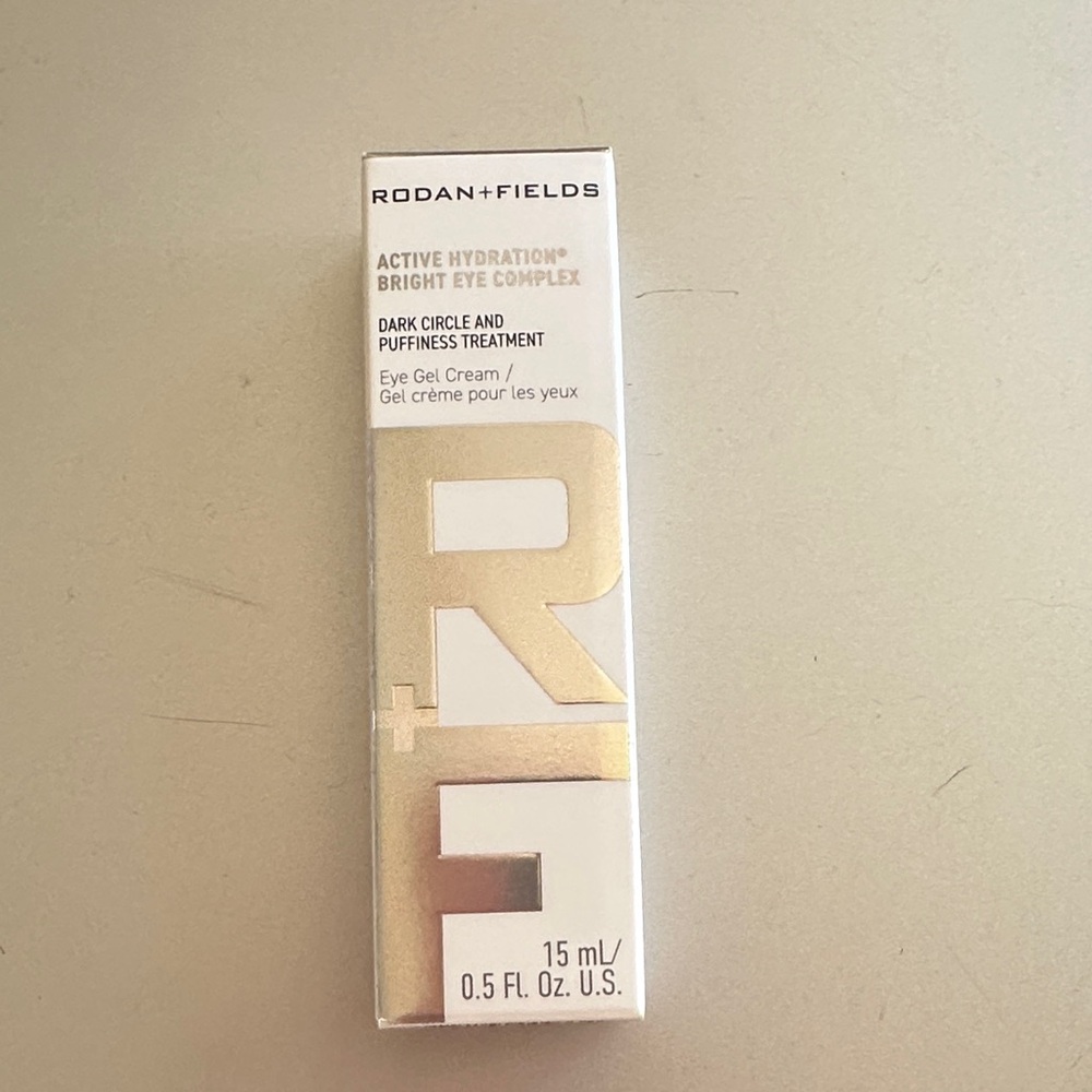 Rodan + Fields Bright Eye Complex in White and Gold Accents